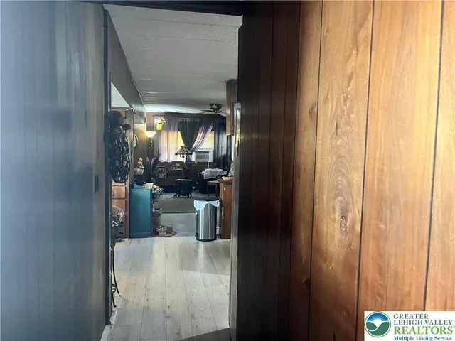 a kitchen with refrigerator and table