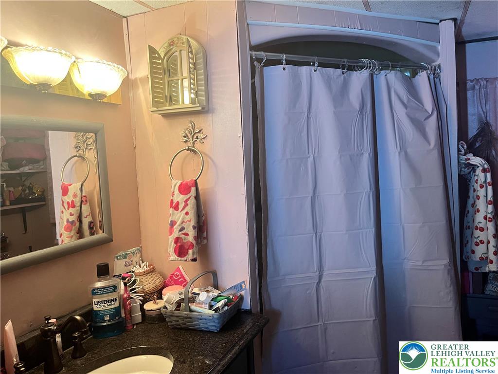 45 Sycamore Drive Bath, PA 18014 - Photo 13 of 18 a bedroom with a bed and a table