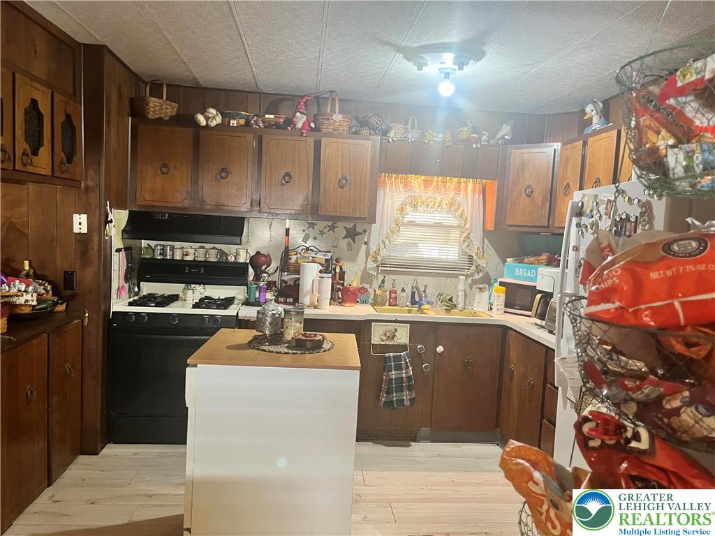 45 Sycamore Drive Bath, PA 18014 - Photo 4 of 18 a kitchen with stainless steel appliances granite countertop a sink stove and refrigerator