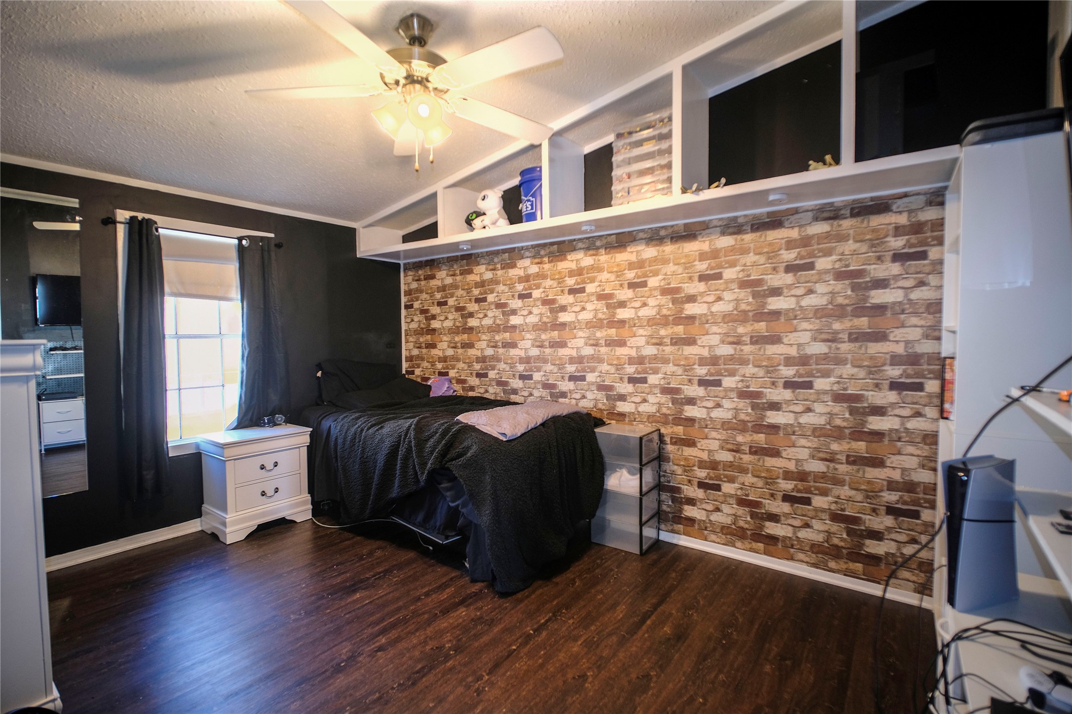 5406 Five Oaks Drive Spring, TX 77389 - Photo 20 of 26 Alternate view of brick accent wall and cozy seating area.
