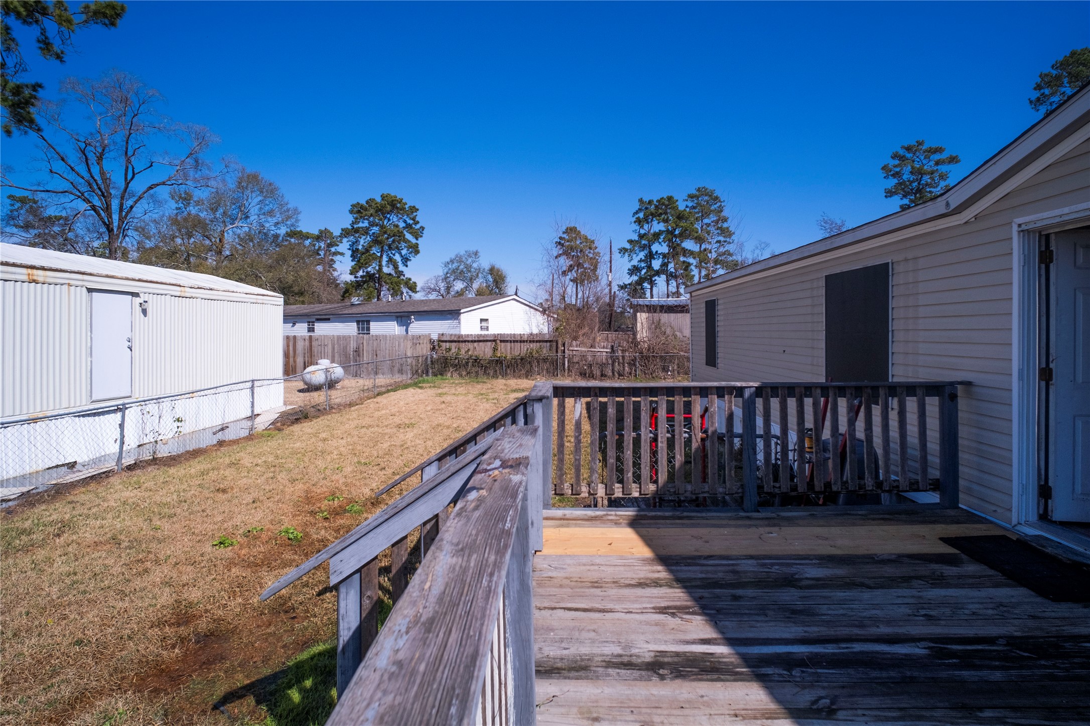 5406 Five Oaks Drive Spring, TX 77389 - Photo 3 of 26 Outdoor deck area ideal for relaxing or entertaining.