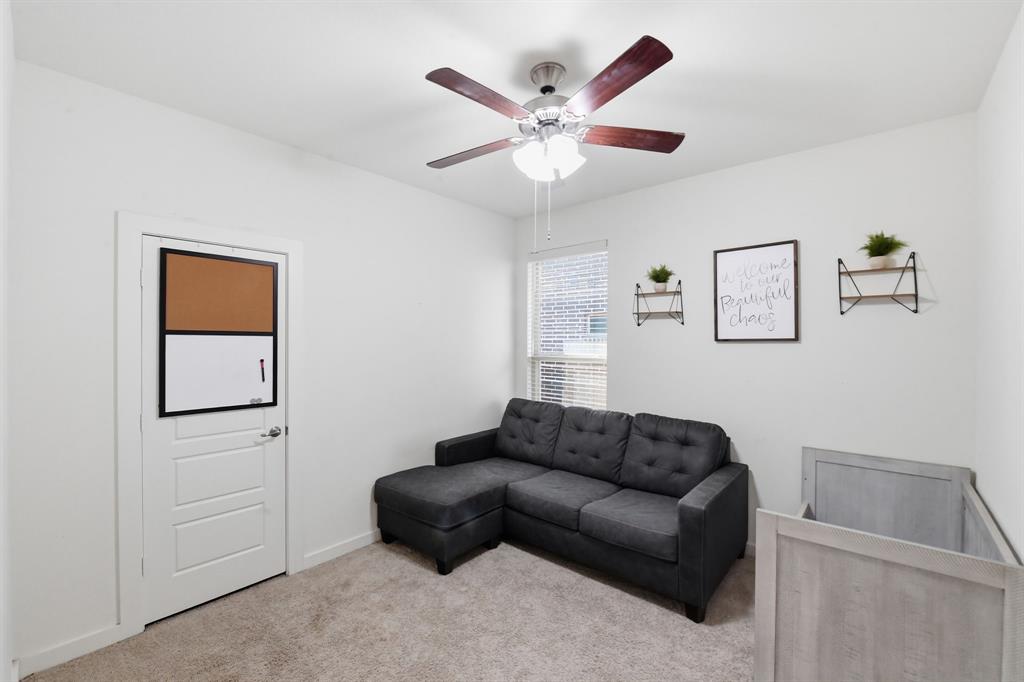 7645 Spring Drive Watauga, TX 76148 - Photo 24 of 28 a living room with furniture and a ceiling fan