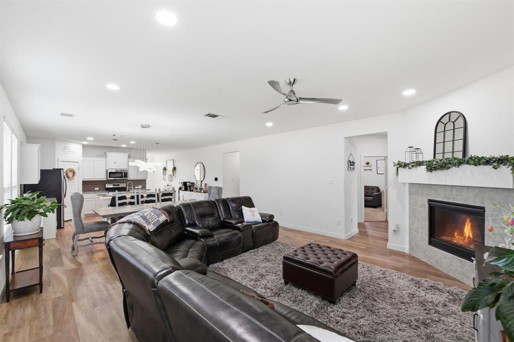 7645 Spring Drive Watauga, TX 76148 - Photo 3 of 28 a living room with furniture and a fireplace