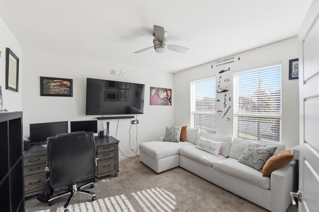 7645 Spring Drive Watauga, TX 76148 - Photo 7 of 28 a living room with furniture and a flat screen tv