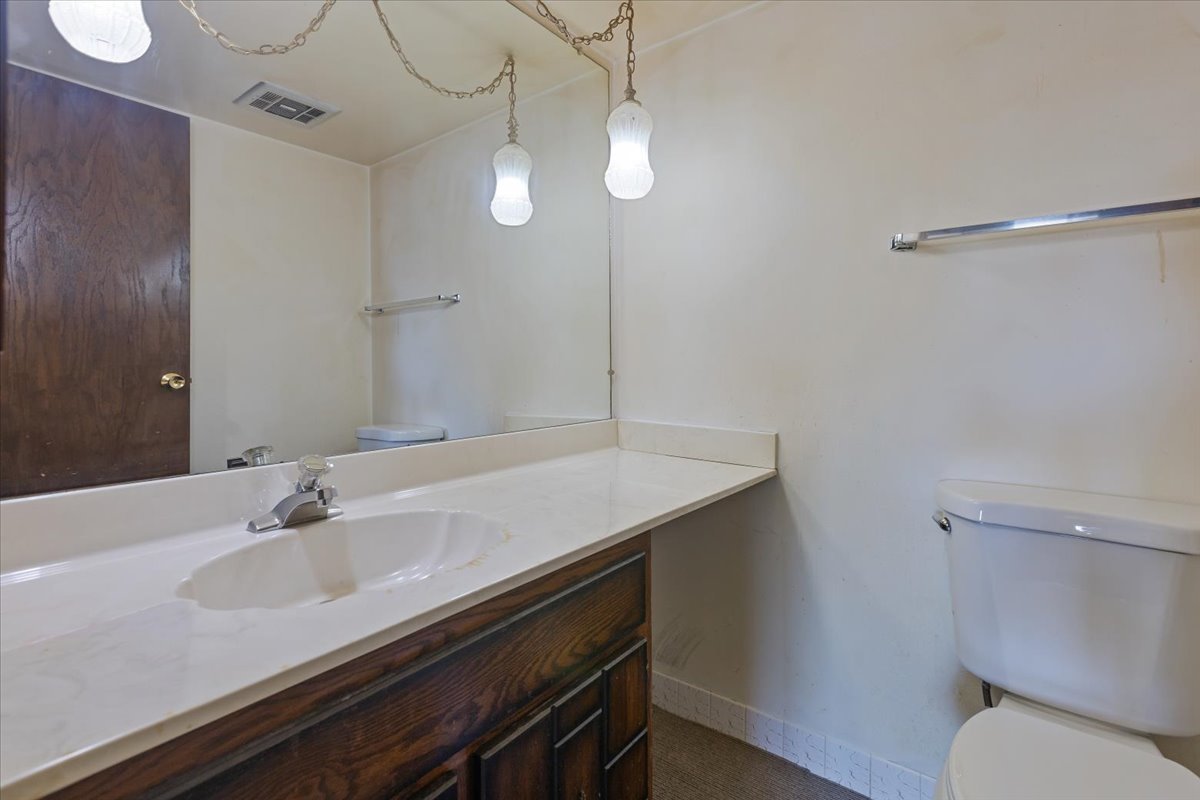 820 Elder Road, Unit C410 Homewood, IL 60430 - Photo 13 of 19 a bathroom with a sink and a toilet