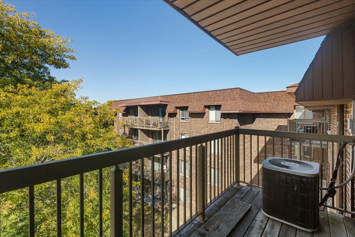 820 Elder Road, Unit C410 Homewood, IL 60430 - Photo 4 of 19 a view of a balcony with chairs