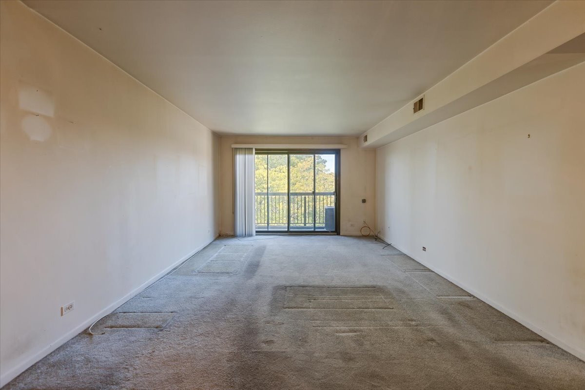 820 Elder Road, Unit C410 Homewood, IL 60430 - Photo 5 of 19 a view of an empty room with a window