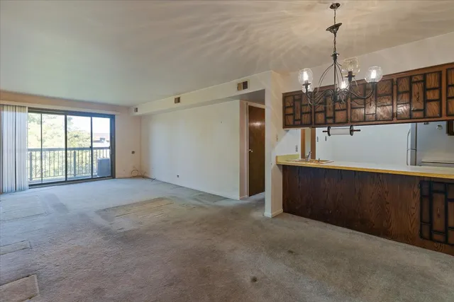 a view of a room with lots of wooden floor