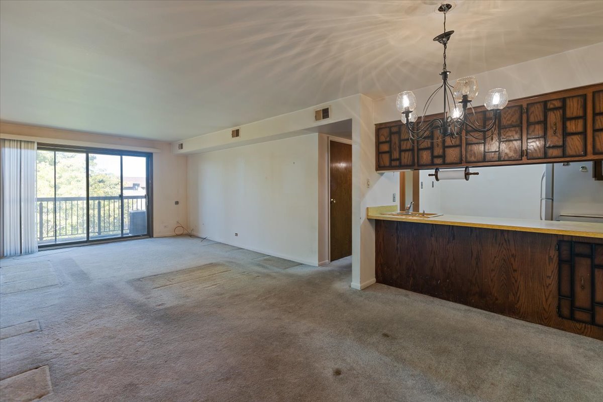 820 Elder Road, Unit C410 Homewood, IL 60430 - Photo 6 of 19 a view of a room with lots of wooden floor
