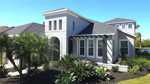 front view of a house with potted plants