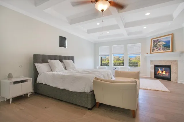 a bed room with furniture and a fireplace