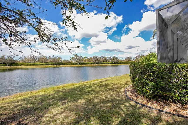 a view of a lake with houses in the back