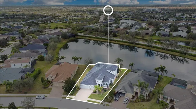 an aerial view of a house with a swimming pool