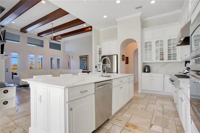 a kitchen with a sink stove and cabinets
