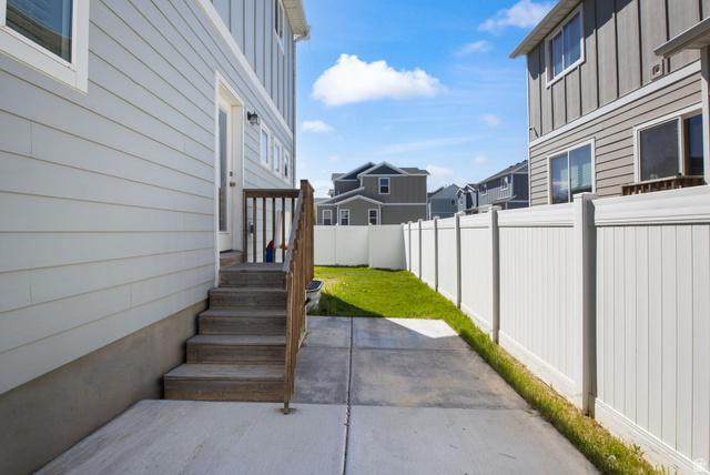 5155 East Rio Grande Way Eagle Mountain, UT 84005 - Photo 30 of 40 Fenced backyard featuring a residential view