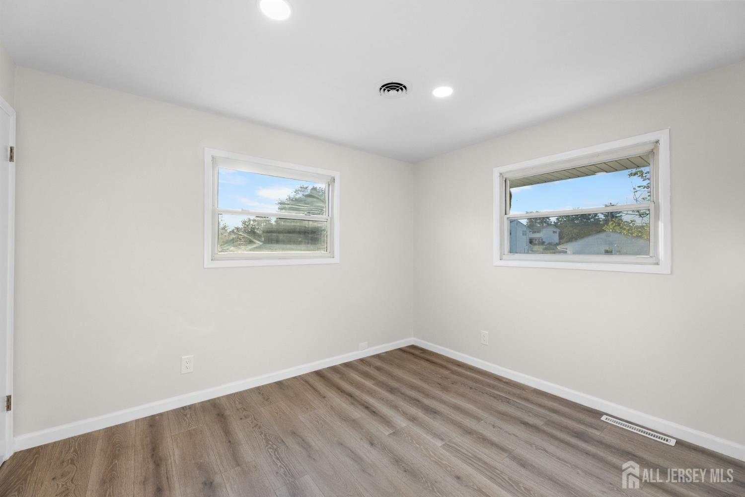 41 Raleigh Road Kendall Park, NJ 08824 - Photo 24 of 40 a view of room with wooden floor and window