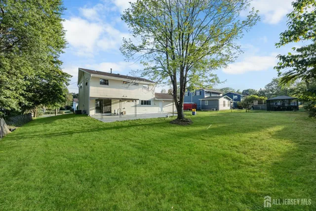 a view of a house with a big yard