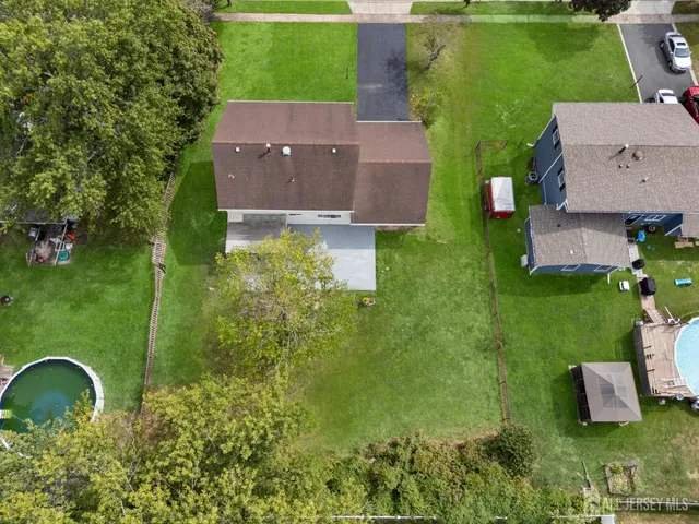 an aerial view of a house with a garden