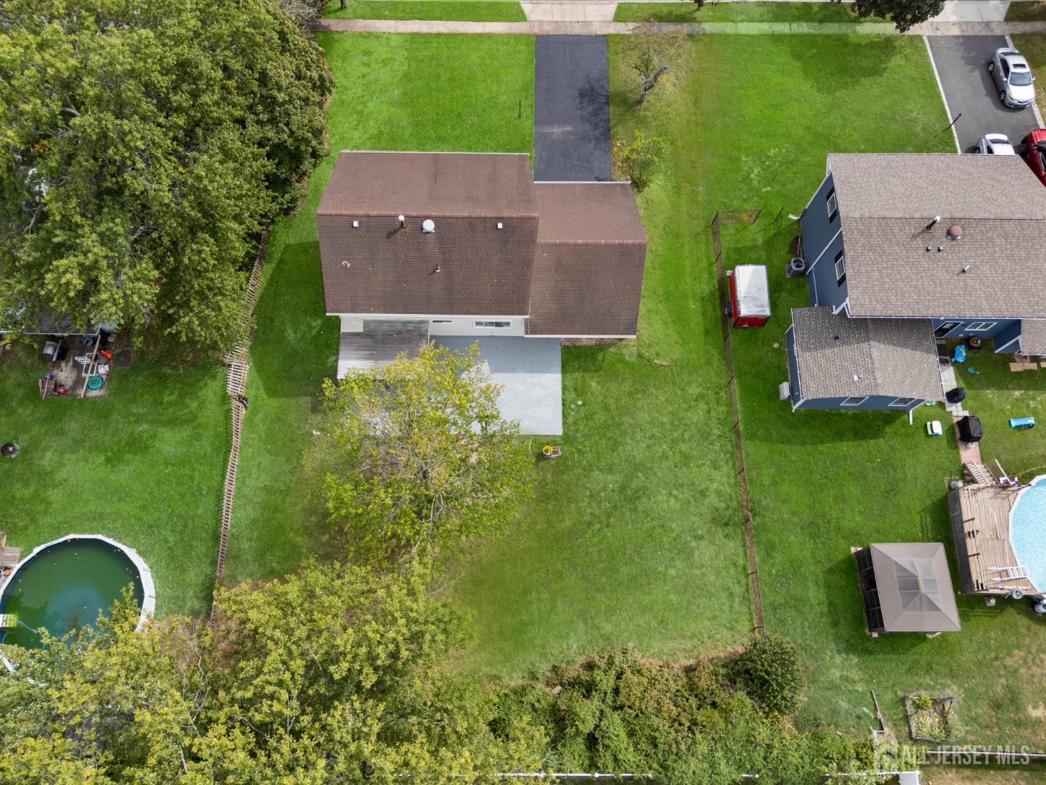 41 Raleigh Road Kendall Park, NJ 08824 - Photo 35 of 40 an aerial view of a house with a garden