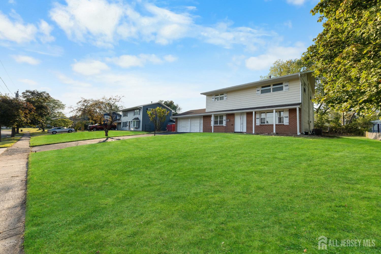 41 Raleigh Road Kendall Park, NJ 08824 - Photo 4 of 40 a view of a house with a big yard