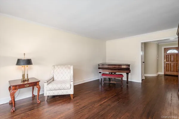 a room with furniture and a wooden floor