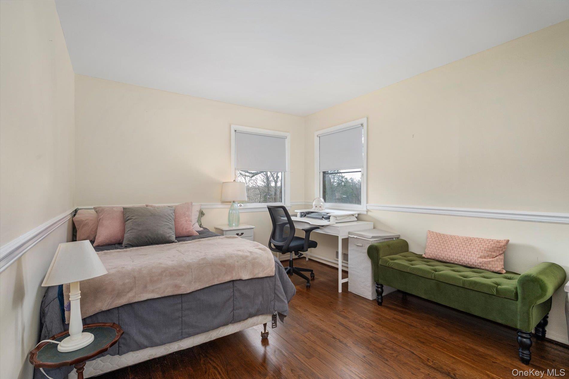 60 Ridge Drive Plainview, NY 11803 - Photo 16 of 27 a living room with furniture and a wooden floor