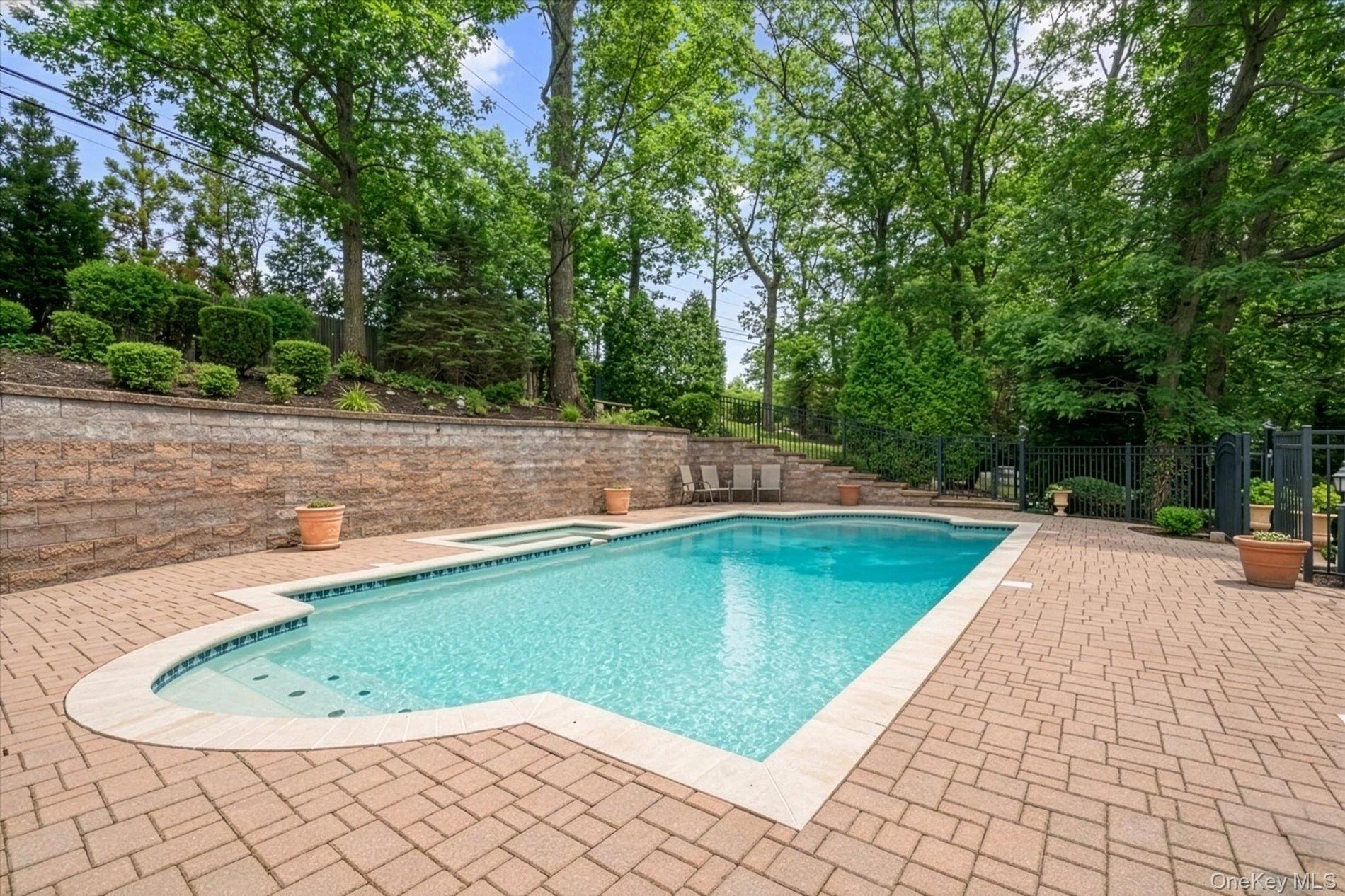 60 Ridge Drive Plainview, NY 11803 - Photo 23 of 27 a view of a swimming pool with a yard and sitting area
