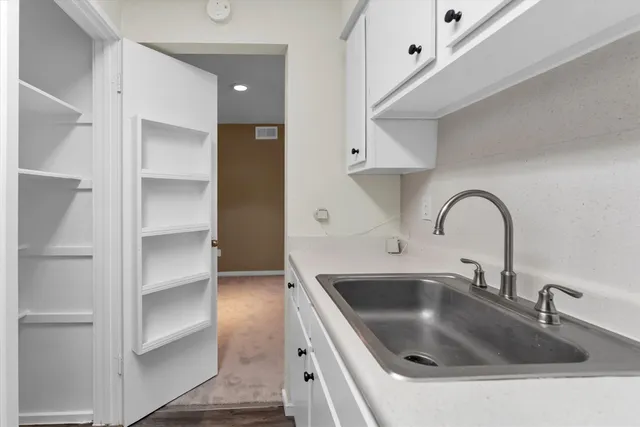 a view of an empty room and a window