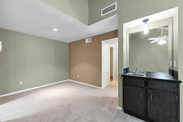 a bathroom with double sink and a mirror