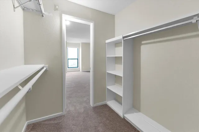 a bathroom with double sink and a mirror