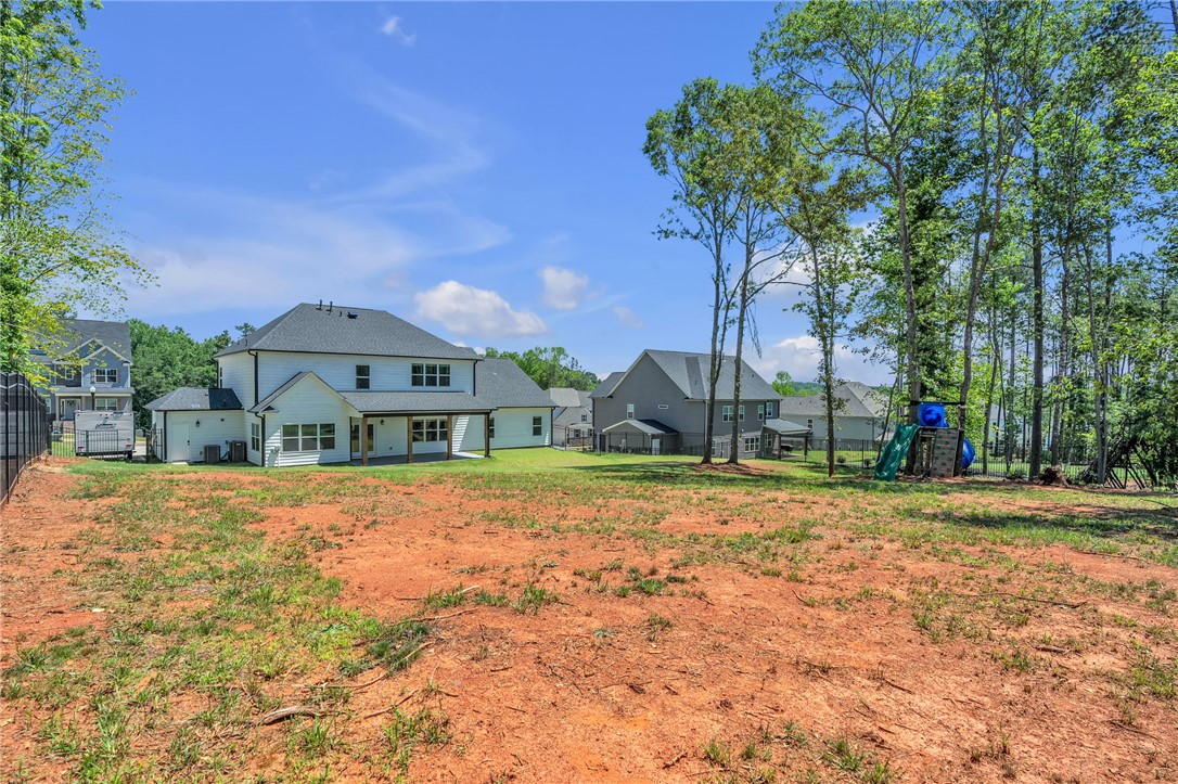 226 Holly Br Road Piedmont, SC 29673 - Photo 39 of 44 A spacious yard with new construction homes beyond the ample building site.