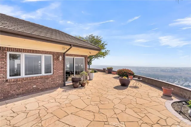 a view of a backyard with sitting area