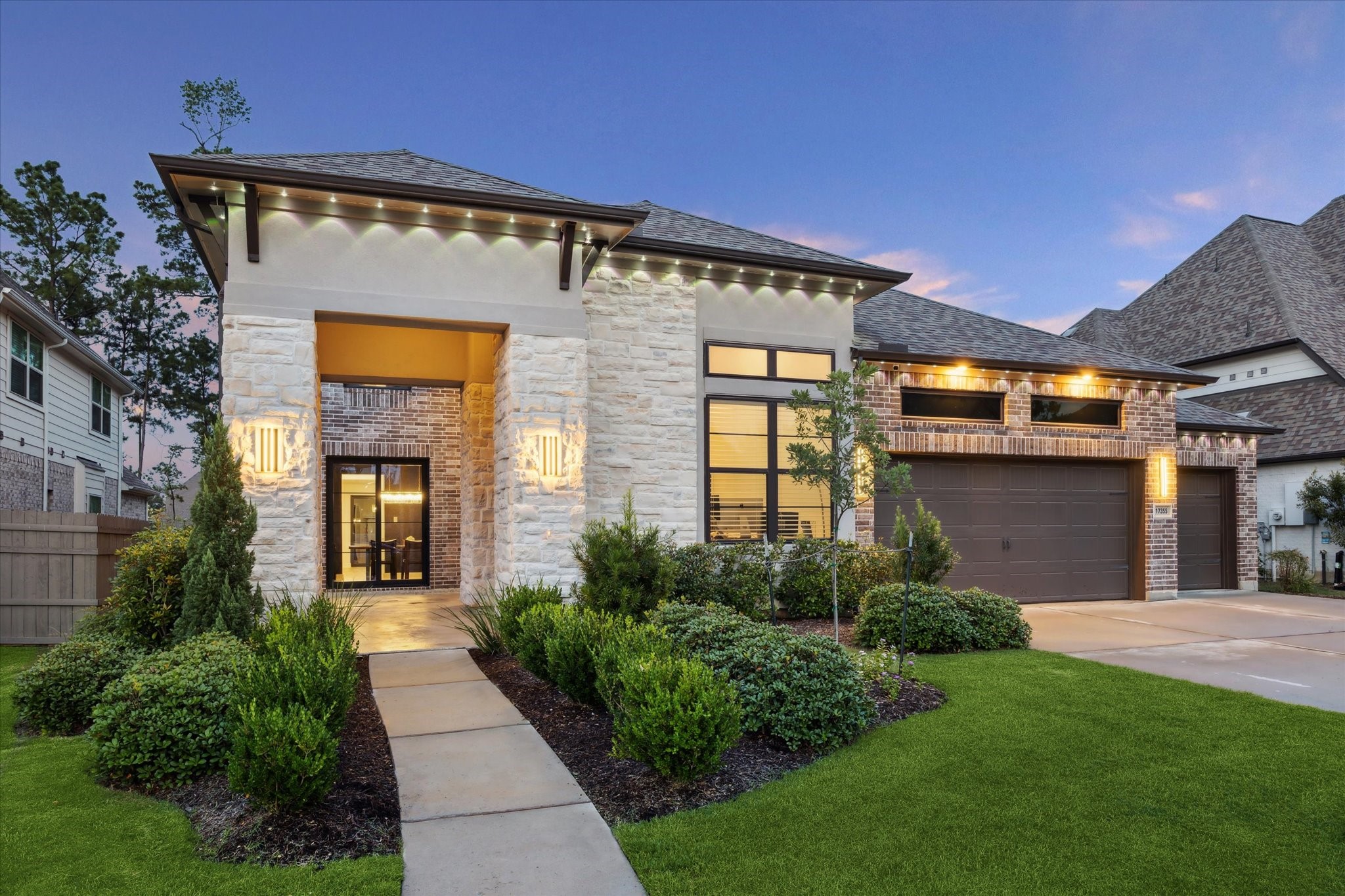 a front view of house with yard and green space