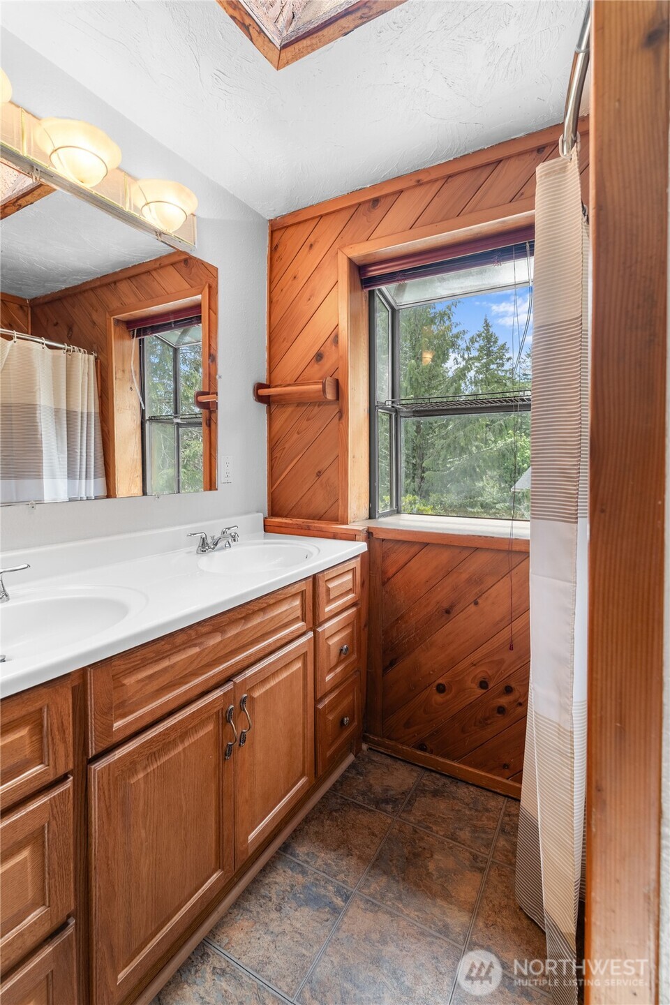 230 East Stavis Road Shelton, WA 98584 - Photo 24 of 35 a bathroom with a sink and a large window