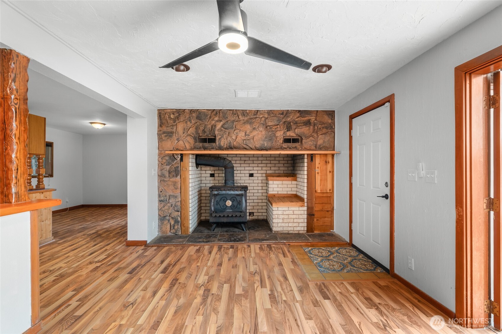 230 East Stavis Road Shelton, WA 98584 - Photo 8 of 35 a view of empty room with wooden floor and window
