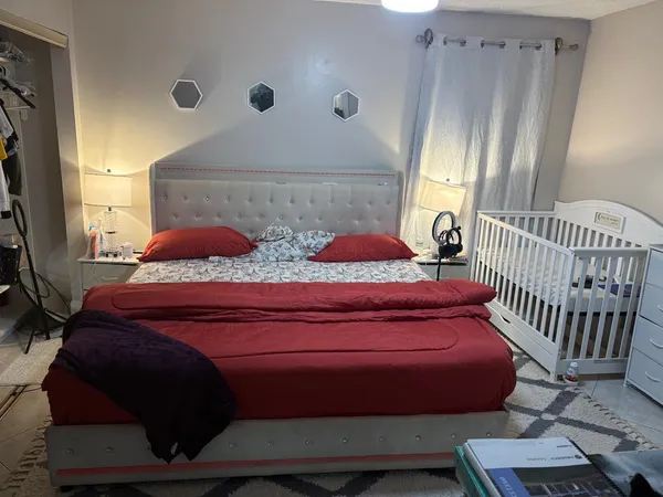 a bedroom with a bed and window