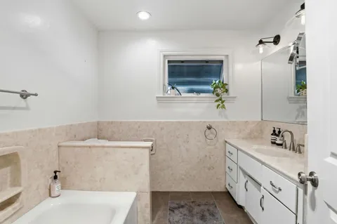 a bathroom with a sink and a bathtub