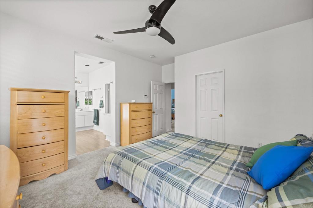2935 Cliff Circle Carlsbad, CA 92010 - Photo 13 of 17 a bedroom with a bed and cabinets