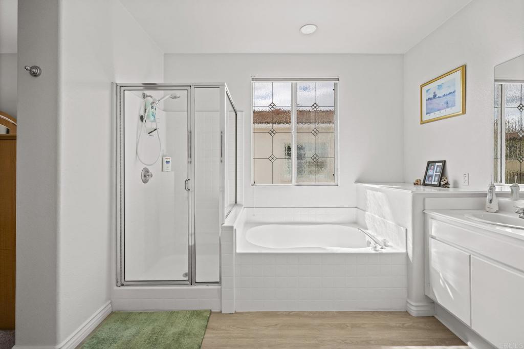 2935 Cliff Circle Carlsbad, CA 92010 - Photo 14 of 17 a bathroom with a tub sink and window