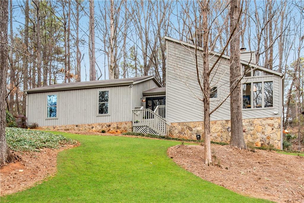 2440 Powder Ridge Roswell, GA 30076 - Photo 1 of 1 a view of a house with yard
