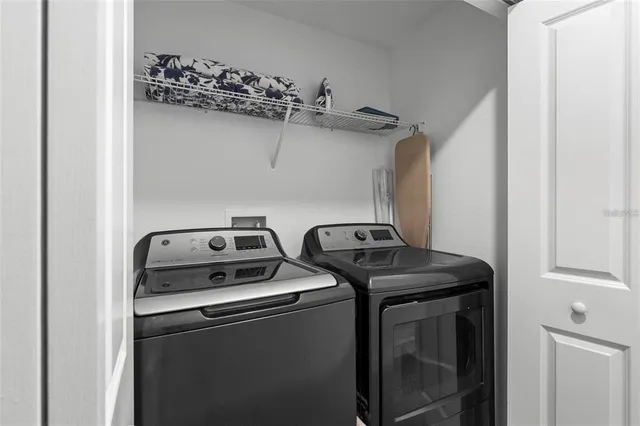 a utility room with dryer and washer
