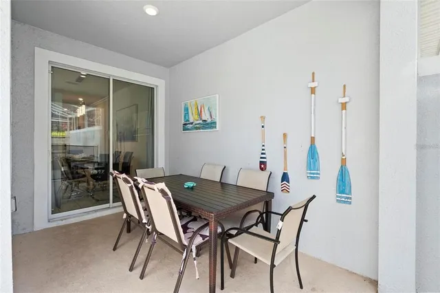 a view of a dining room with furniture and window