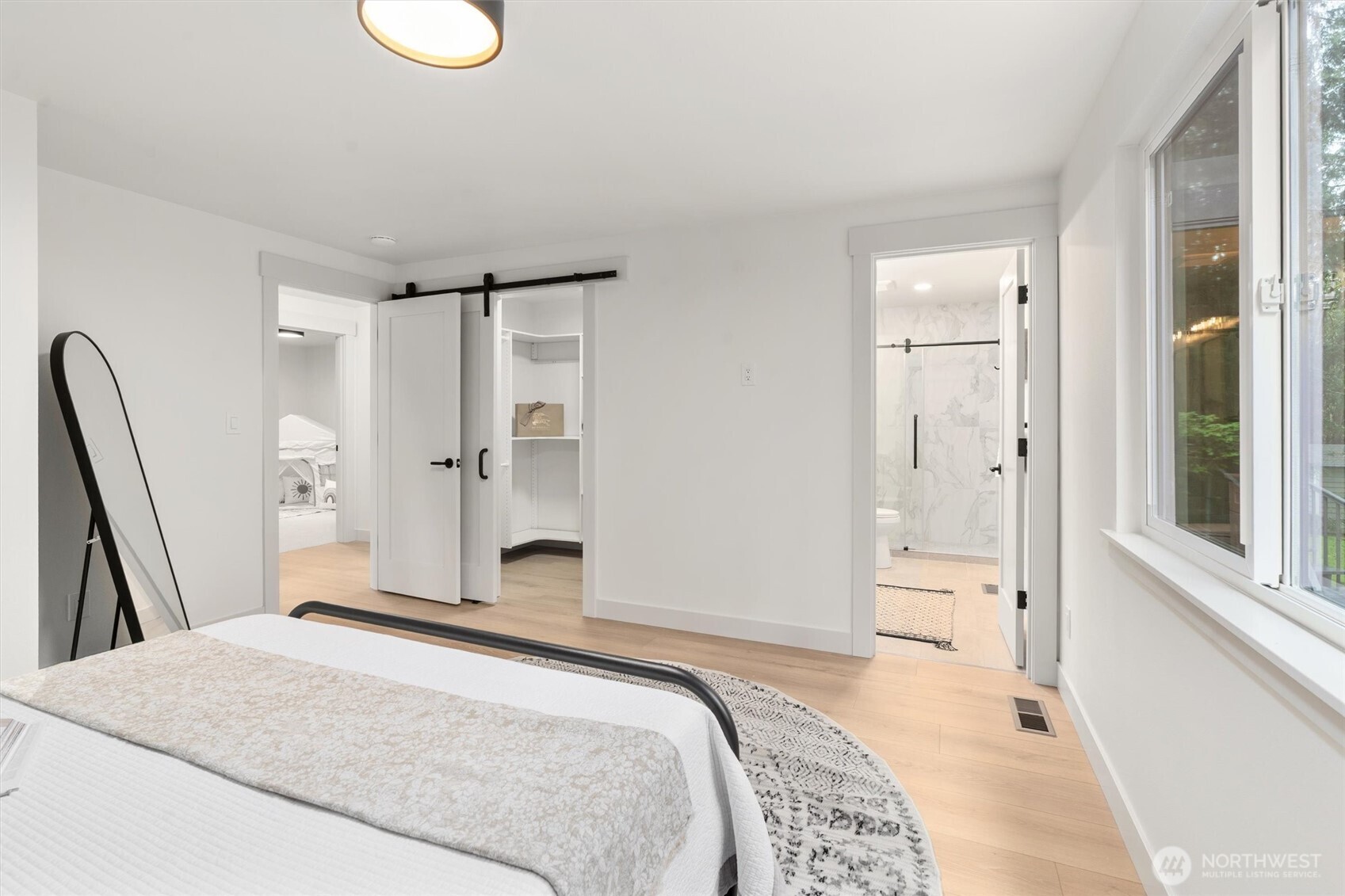 22929 38th Avenue Southeast Bothell, WA 98021 - Photo 12 of 37 a bedroom with a bed and a large mirror