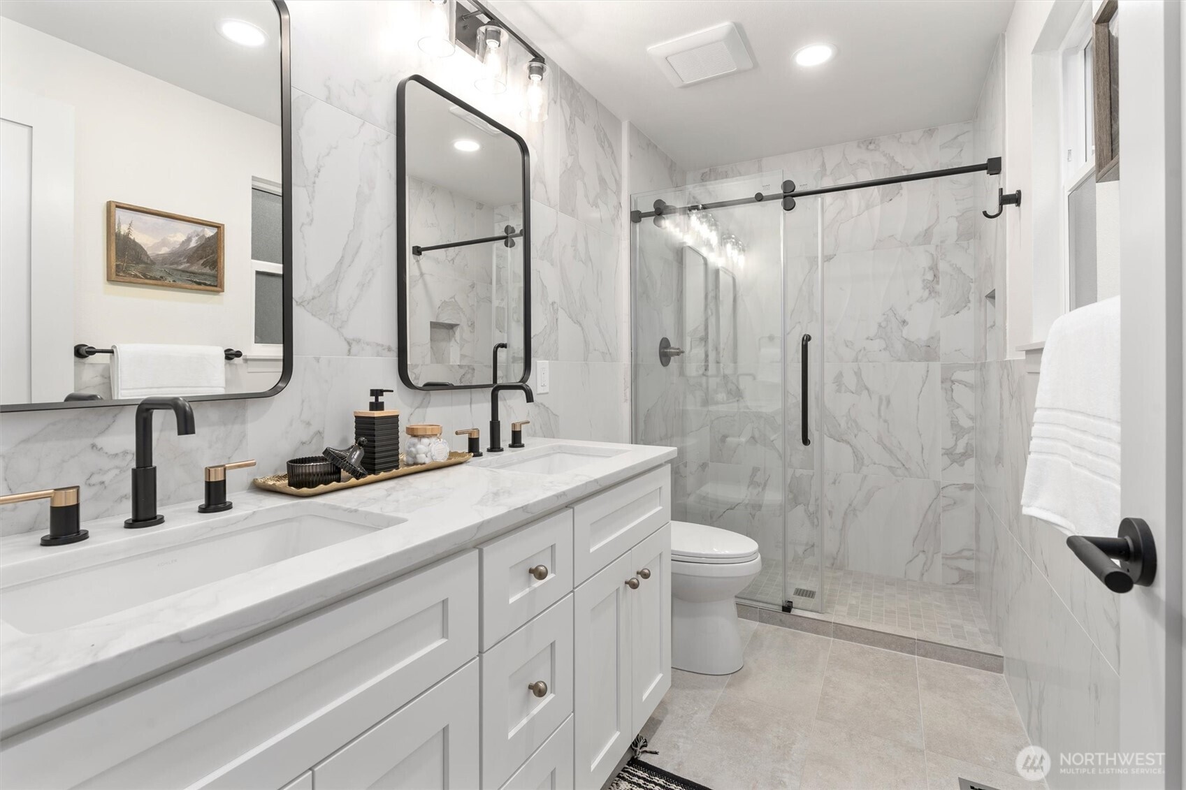 22929 38th Avenue Southeast Bothell, WA 98021 - Photo 13 of 37 a bathroom with a double vanity sink toilet and shower