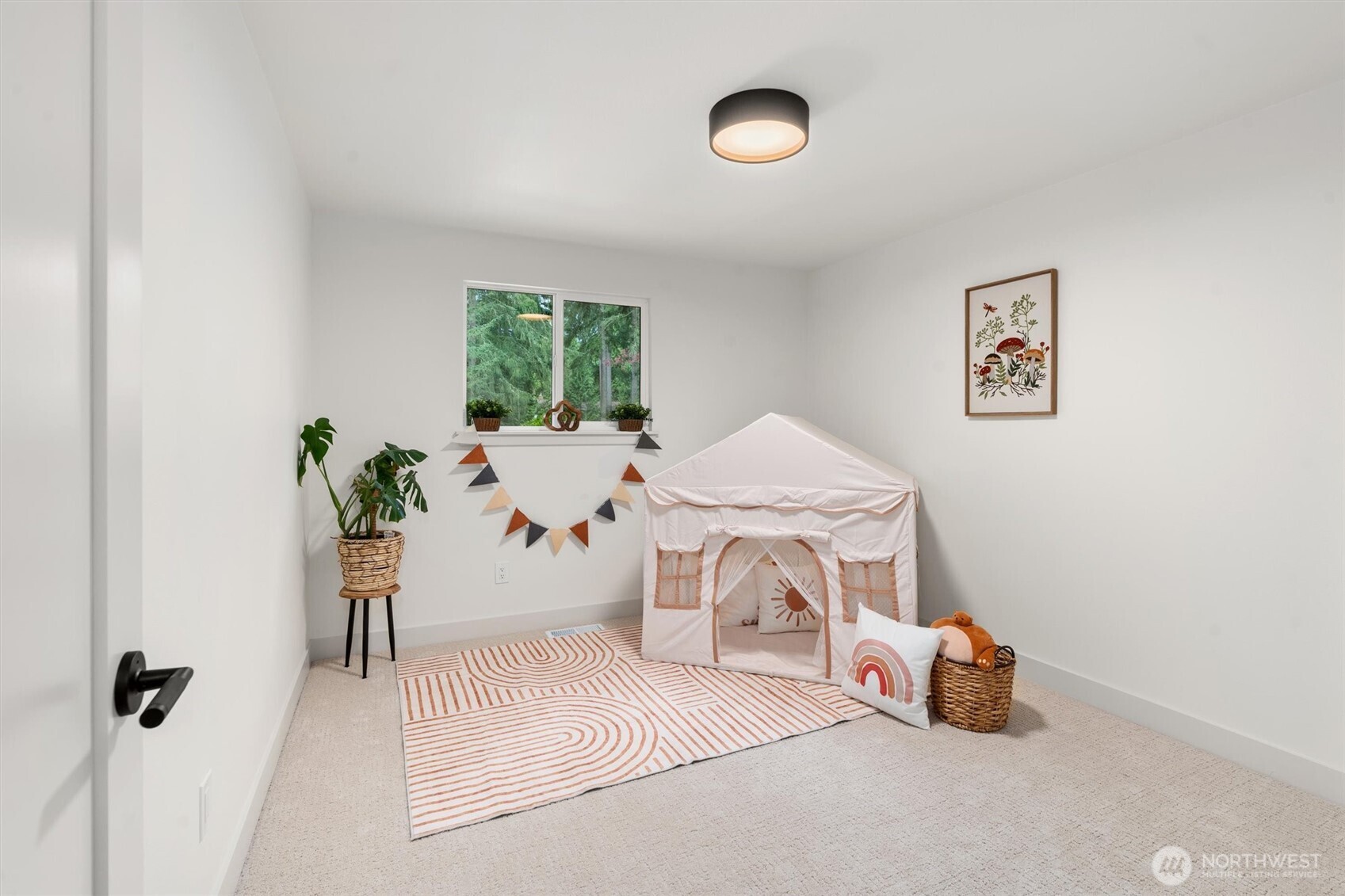 22929 38th Avenue Southeast Bothell, WA 98021 - Photo 15 of 37 a room with a table and a potted plant