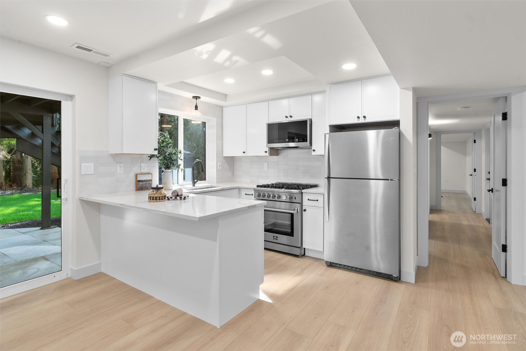 22929 38th Avenue Southeast Bothell, WA 98021 - Photo 20 of 37 a kitchen with stainless steel appliances a refrigerator stove and sink