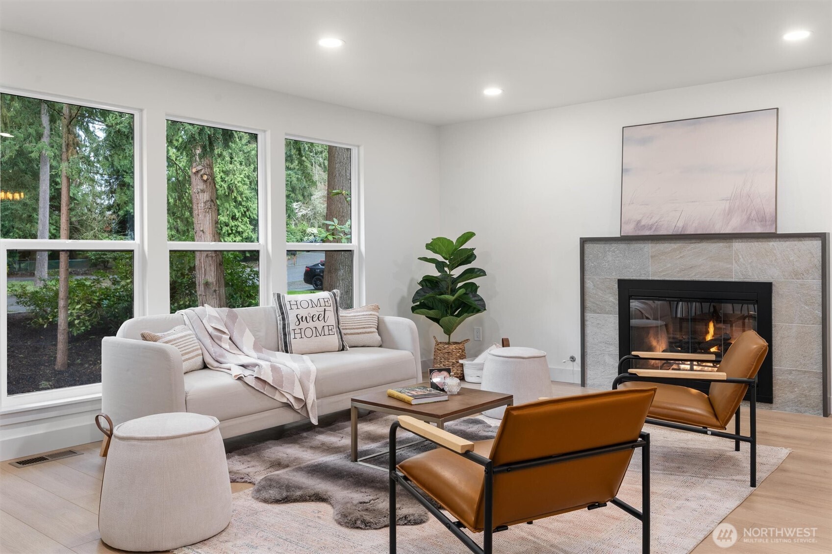 22929 38th Avenue Southeast Bothell, WA 98021 - Photo 2 of 37 a living room with furniture and a fireplace