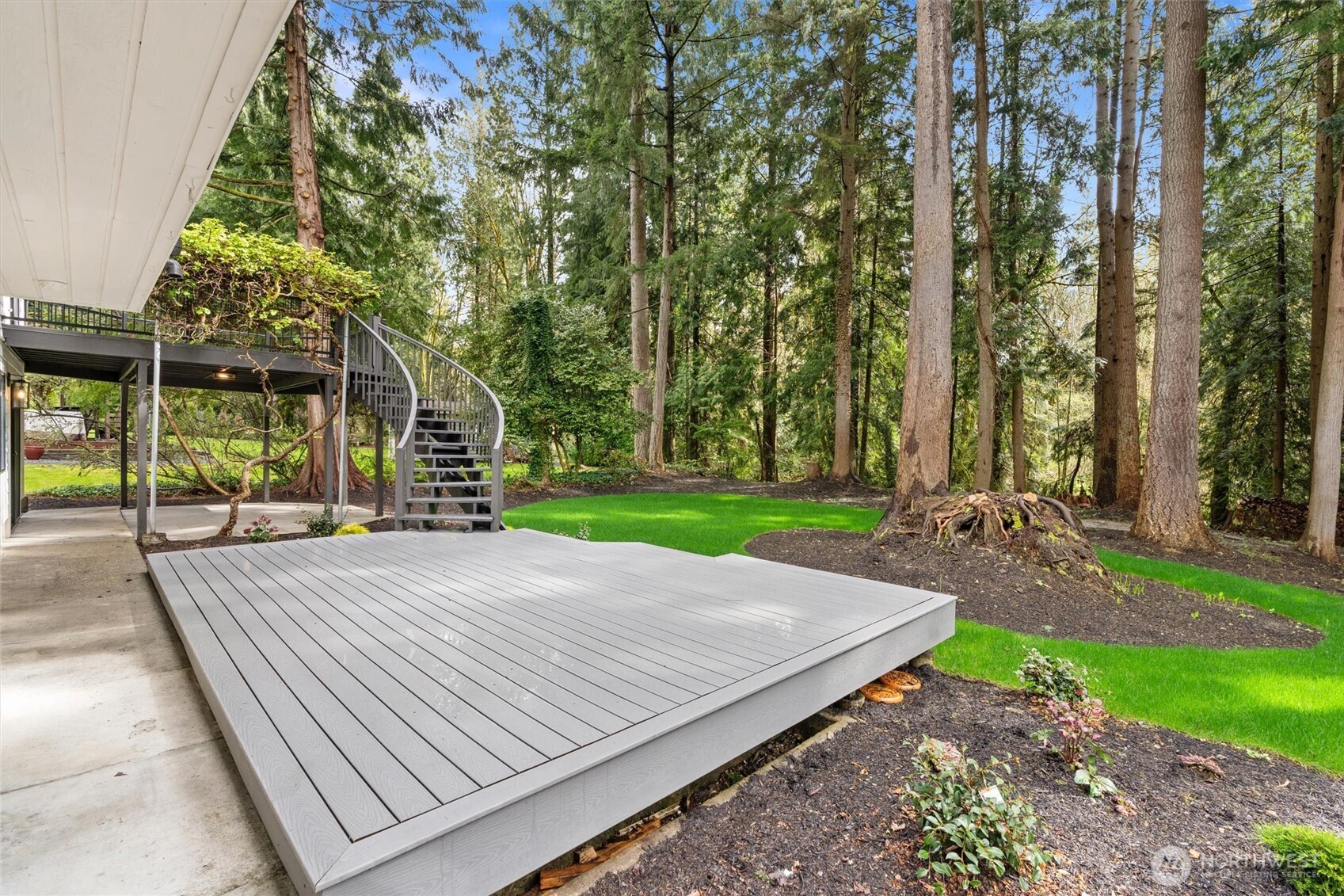22929 38th Avenue Southeast Bothell, WA 98021 - Photo 25 of 37 a view of a backyard with brick wall and plants