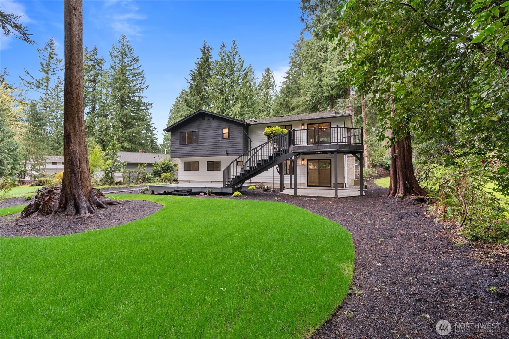 22929 38th Avenue Southeast Bothell, WA 98021 - Photo 27 of 37 a view of a house with backyard and a tree