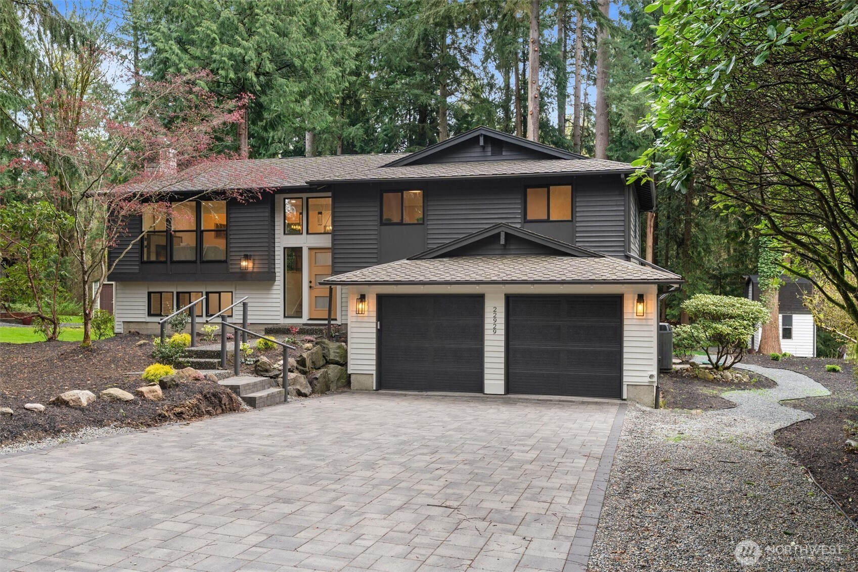 22929 38th Avenue Southeast Bothell, WA 98021 - Photo 33 of 37 a front view of a house with a yard and garage